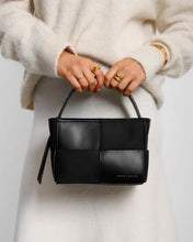 Load image into Gallery viewer, Taya Hand Woven Suedette Top Handle Bag in Black - Katie Loxton